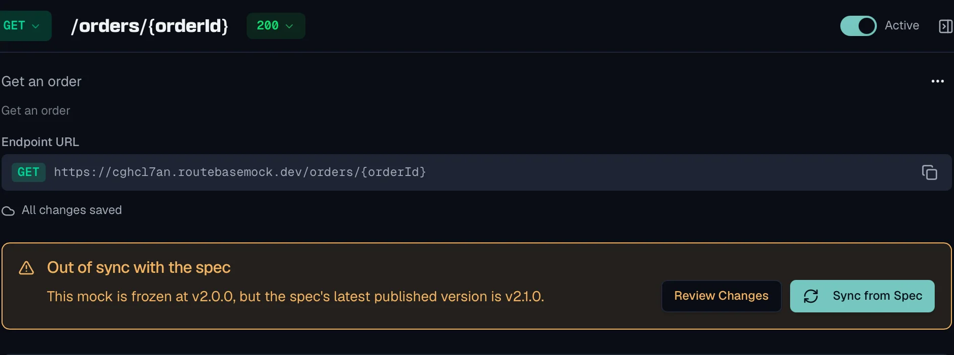 A mock rule for GET /orders/{orderId} with a warning banner headed Out of sync with the spec, reading that the mock is frozen at v2.0.0 while the spec's latest published version is v2.1.0, next to a Review Changes button and a Sync from Spec button.